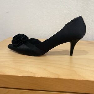 Adrianna Papell Black Satin Heels with Floral Embellishment at throat.